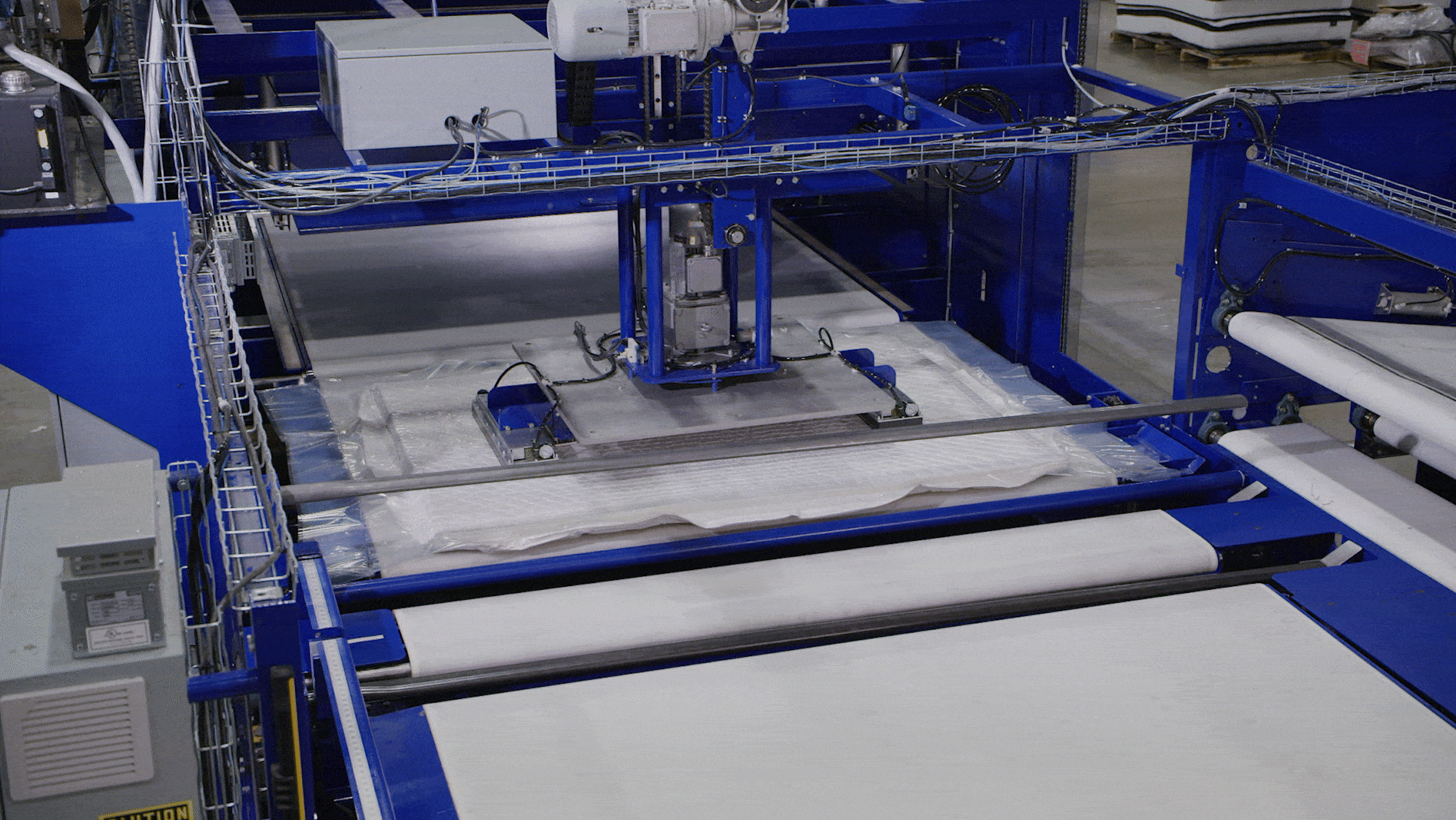 Rotate add-on minimizing poly film in action on a compression machine. 